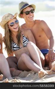Teenage Couple Enjoying Beach Holiday Together