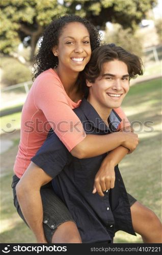 Teenage Couple Having Fun In Playground