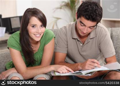 Teenage couple studying
