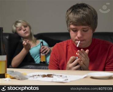Teenage Couple Taking Drugs At Home