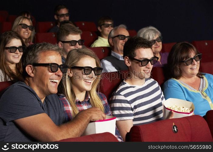 Teenage Family Watching 3D Film In Cinema