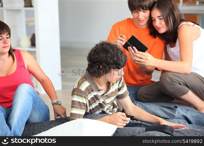 Teenage friends hanging out at home