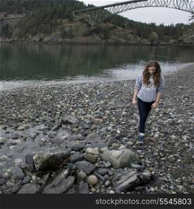 Teenage girl at the lakeside, Deception Pass State Park, Oak Harbor, Washington State, USA