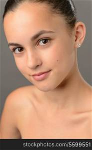 Teenage girl bare shoulders skin care beauty close-up gray shoulders