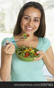 Teenage Girl Eating A Salad