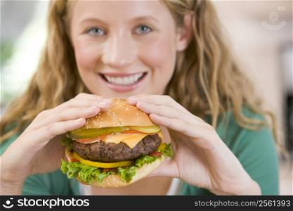 Teenage Girl Eating Burgers