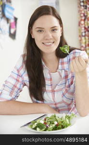 Teenage Girl Eating Healthy Plate Of Salad