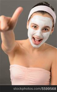 Teenage girl facial mask beauty thumb-up shouting on gray background