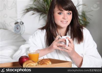 Teenage girl having breakfast