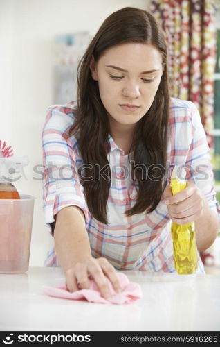 Teenage Girl Helping With Cleaning At Home