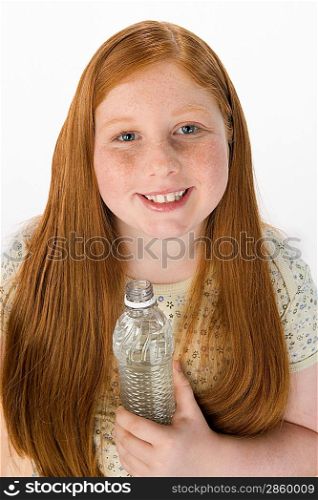 Teenage girl holding bottle, portrait