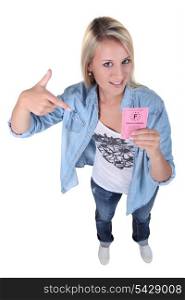 Teenage girl holding driving licence