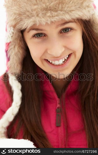 Teenage Girl Holding Snowball Wearing Fur Hat