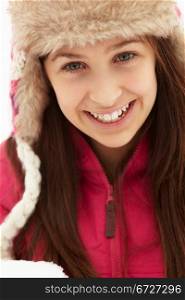 Teenage Girl Holding Snowball Wearing Fur Hat