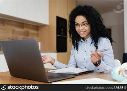 teenage girl home during online school with laptop