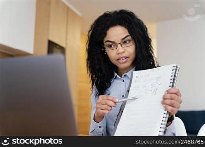 teenage girl home during online school with laptop notebook