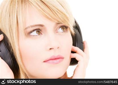 teenage girl in big headphones over white
