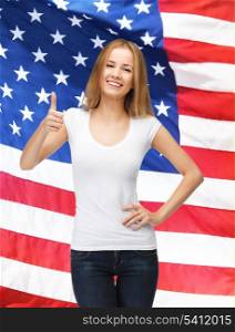 teenage girl in blank white t-shirt with thumbs up and american flag