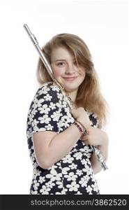 teenage girl in dress holds flute in studio against white background