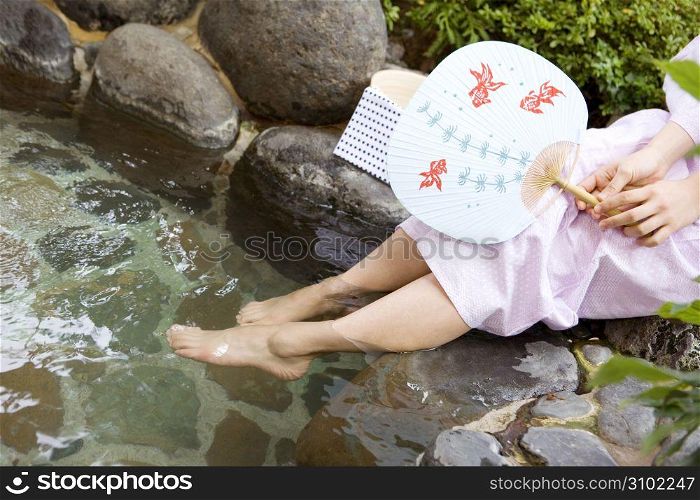 Teenage girl in Japanese garden