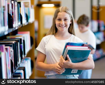 teenage girl in library choosing books. Teenage girl in library