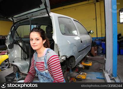 Teenage girl in mechanical professional training