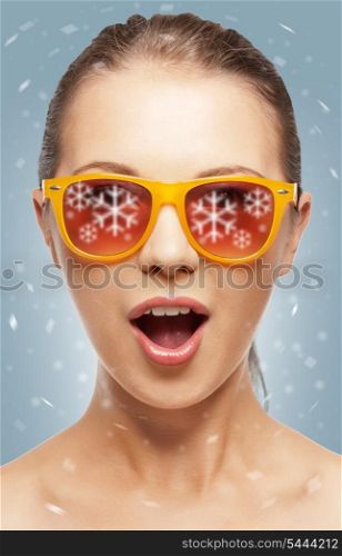 teenage girl in shades with expression of surprise