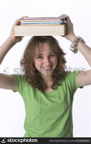 Teenage Girl Is Carrying Books On Her Head
