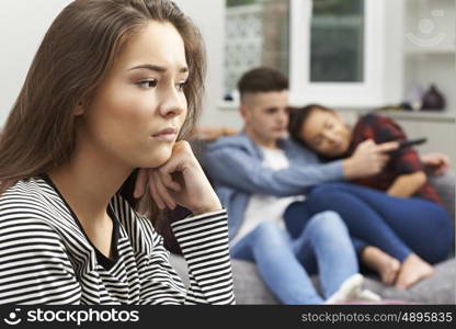 Teenage Girl Jealous Of Young Couple At Home