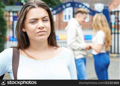 Teenage Girl Jealous Of Young Couple Outside School