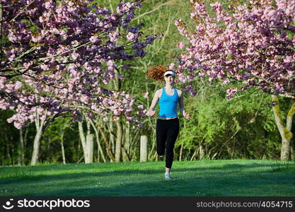 Teenage girl jogging in park