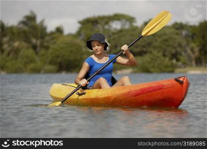Teenage girl kayaking
