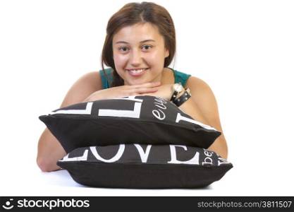 teenage girl laying over pillow on white background