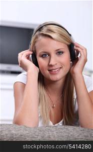 Teenage girl listening to music on headphones