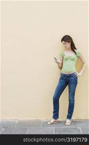 Teenage girl looking at a mobile phone