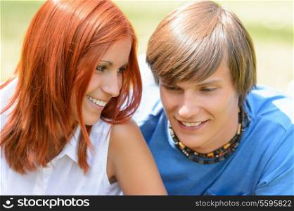 Teenage girl looking at her boyfriend enjoy summer first love
