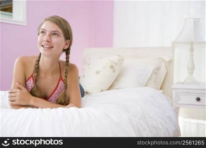 Teenage Girl Lying On Bed