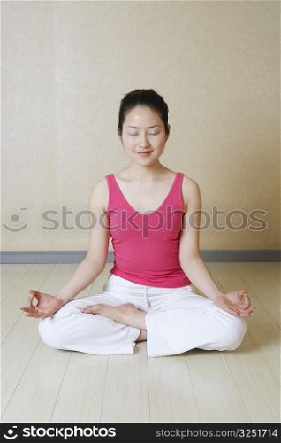 Teenage girl meditating