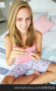 Teenage girl painting nails