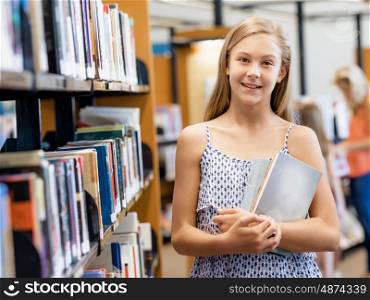 Teenage girl picking a book in public library. That is a difficult choice