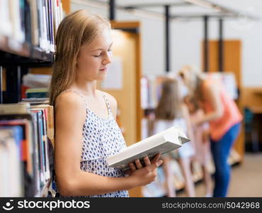 Teenage girl picking a book in public library. That is a difficult choice