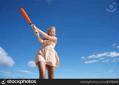 Teenage girl playing baseball