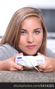 Teenage girl playing on games console