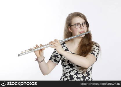 teenage girl plays the flute against white background