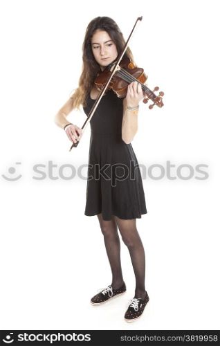 teenage girl plays violin in studio with white background