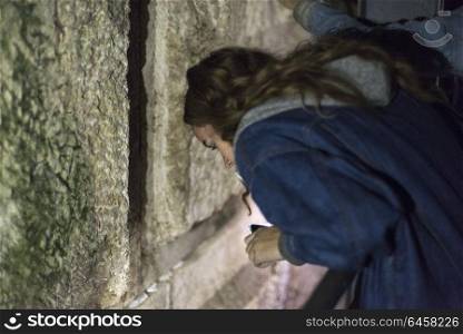 Teenage girl praying at Western Wall, Old City, Israel