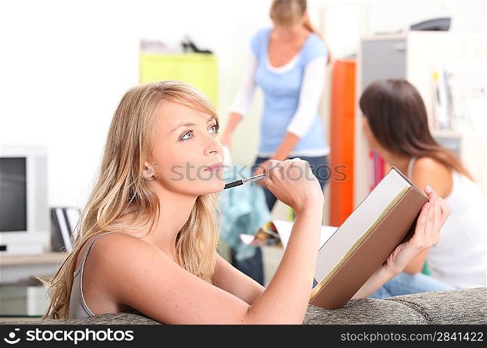Teenage girl revising at home