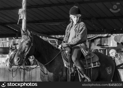 Teenage girl riding horse, Galilee, Israel