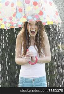 Teenage Girl Sheltering From Rain Beneath Umbrella