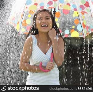 Teenage Girl Sheltering From Rain Beneath Umbrella